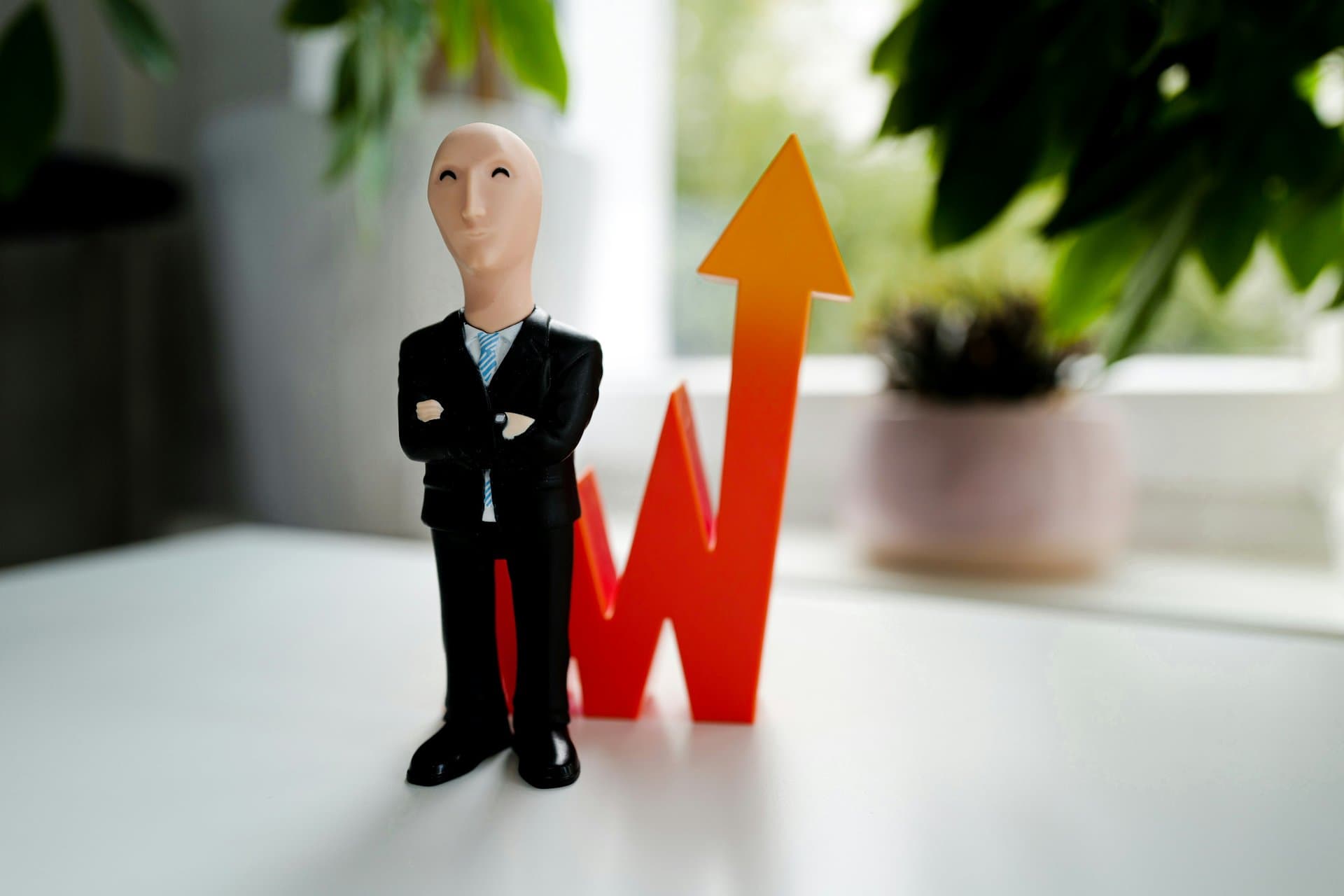 a toy man in black suit
