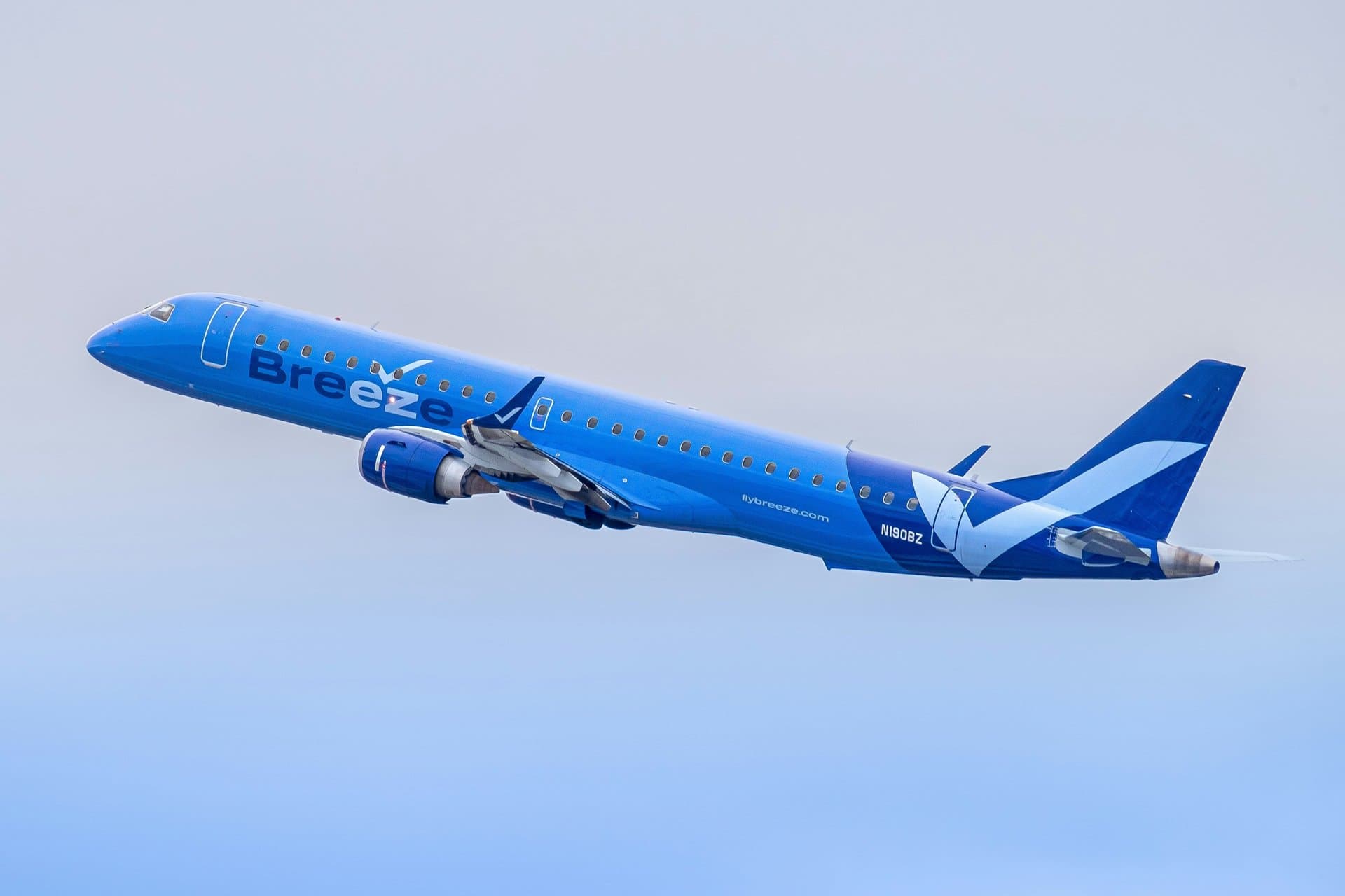 a breeze airlines plane in the air