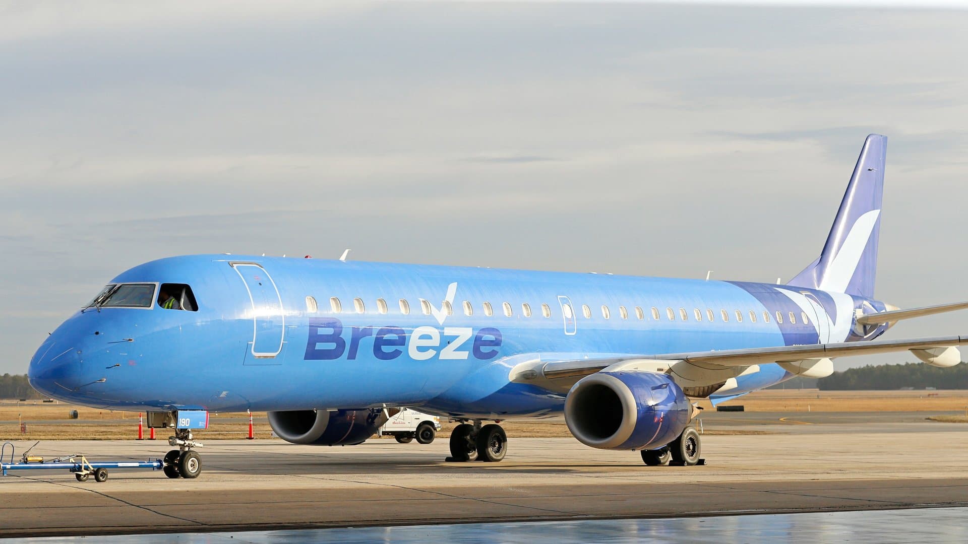 a breeze airways airplane parked