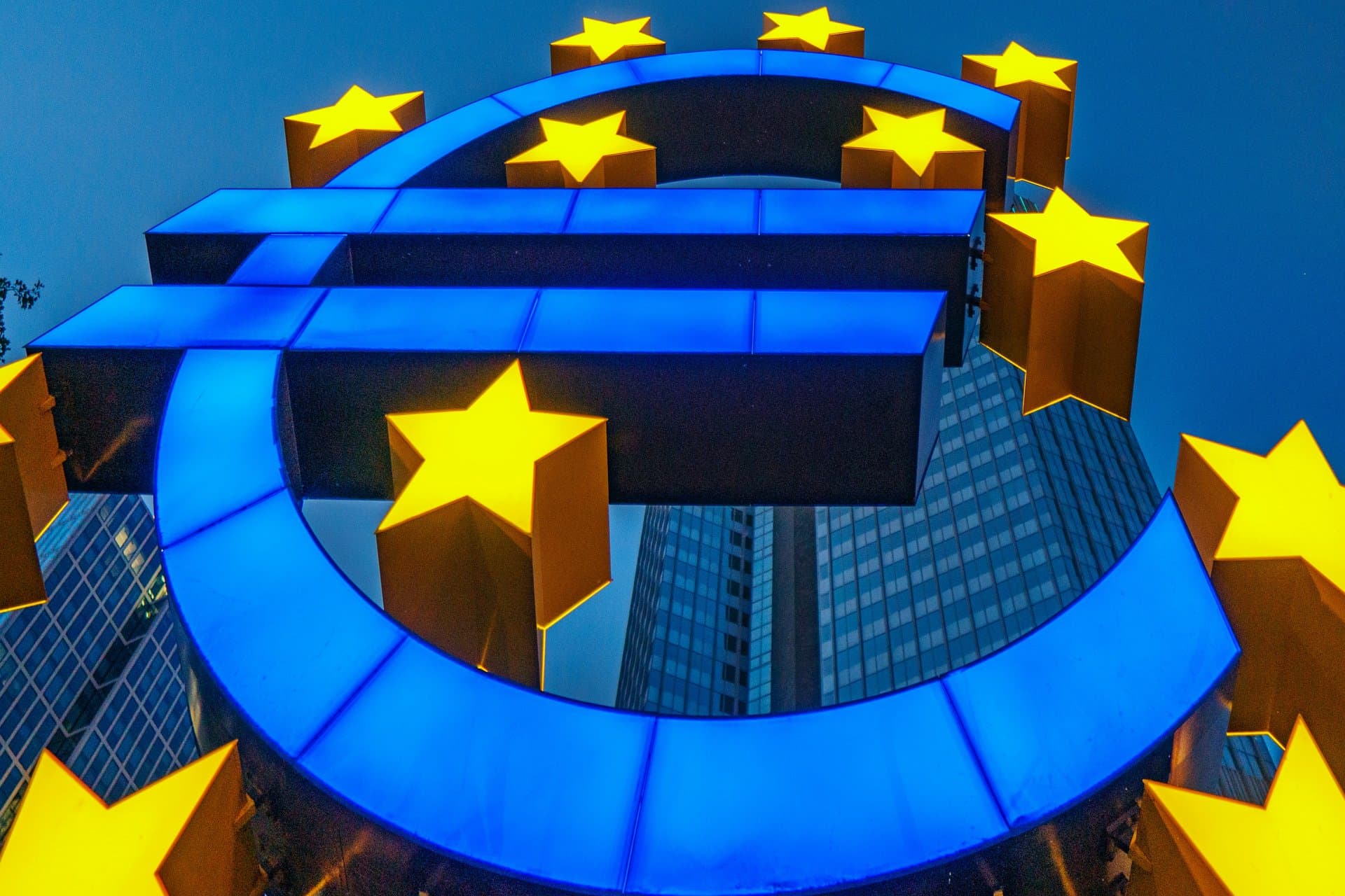 European Union Flag with the Euro statue