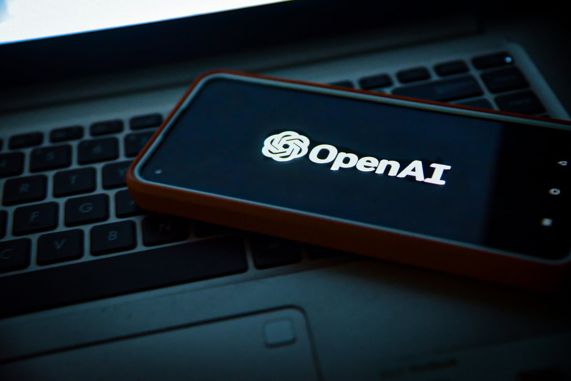a phone with Open AI displayed on it