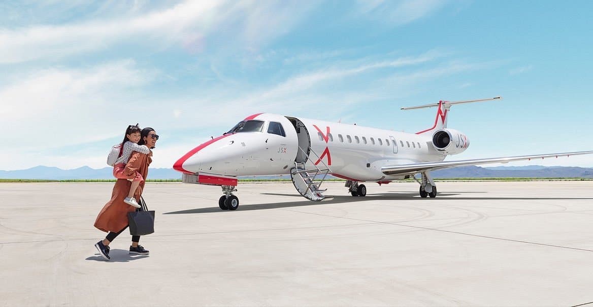 a jsx airline plane parked