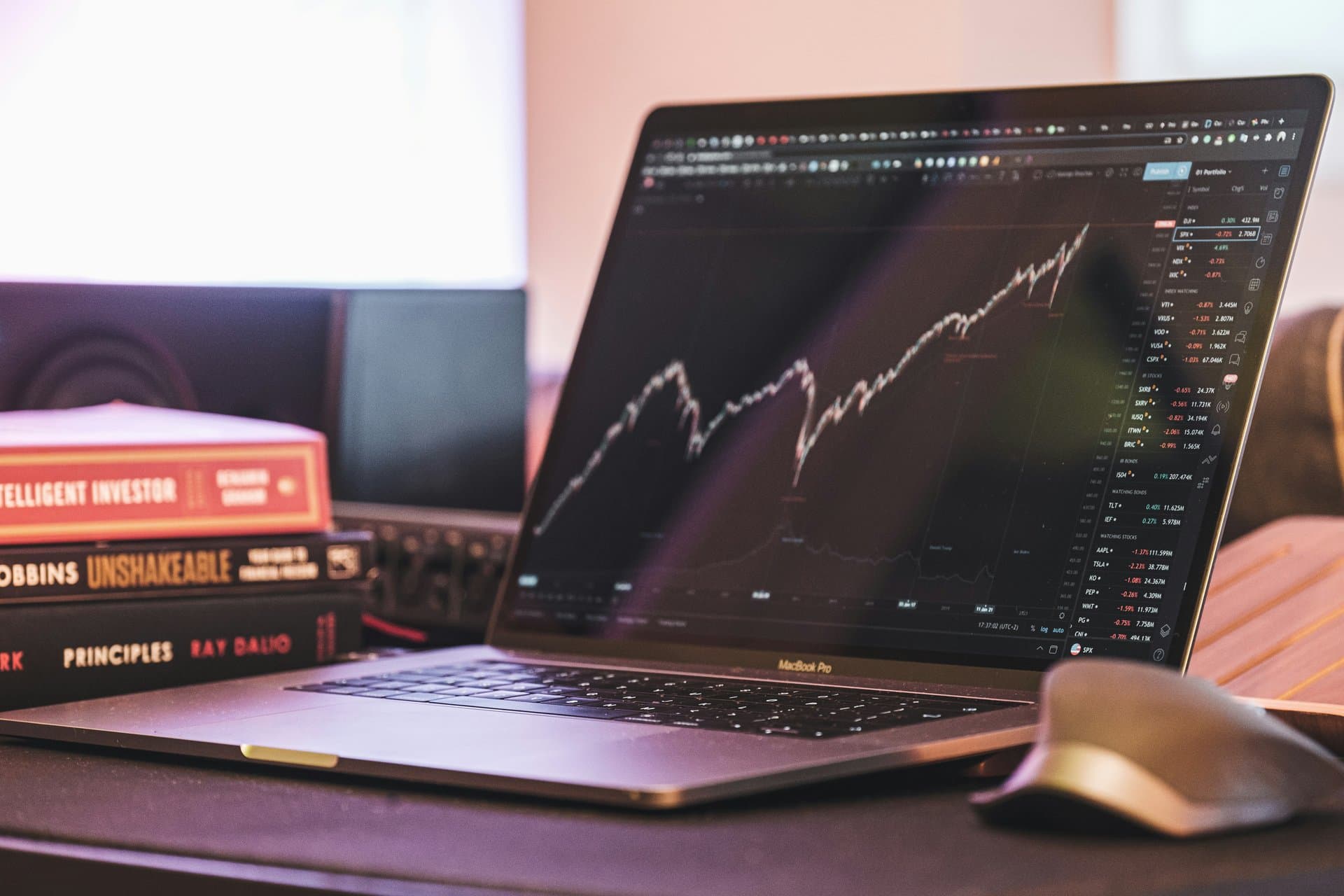 a computer with stocks showing