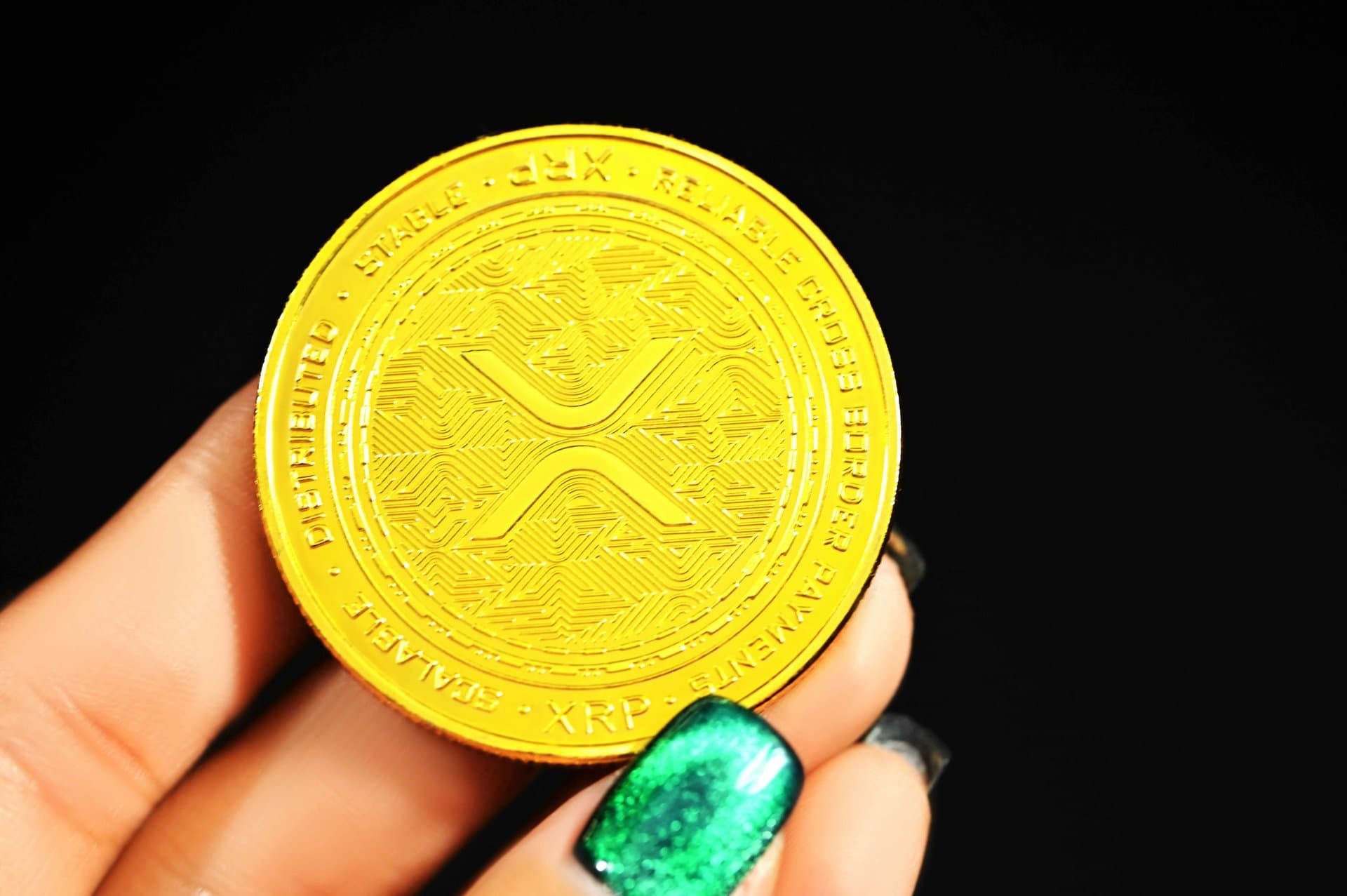 a person holding a gold coin