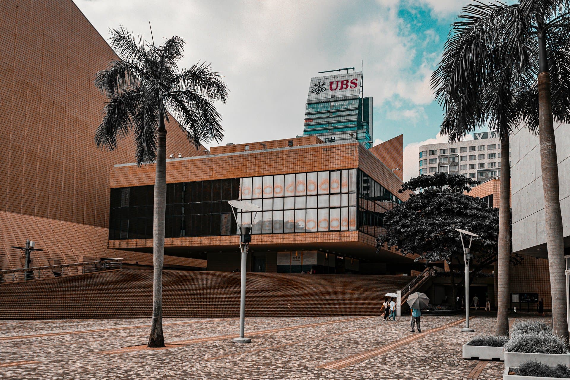 a building surrounded by palm trees