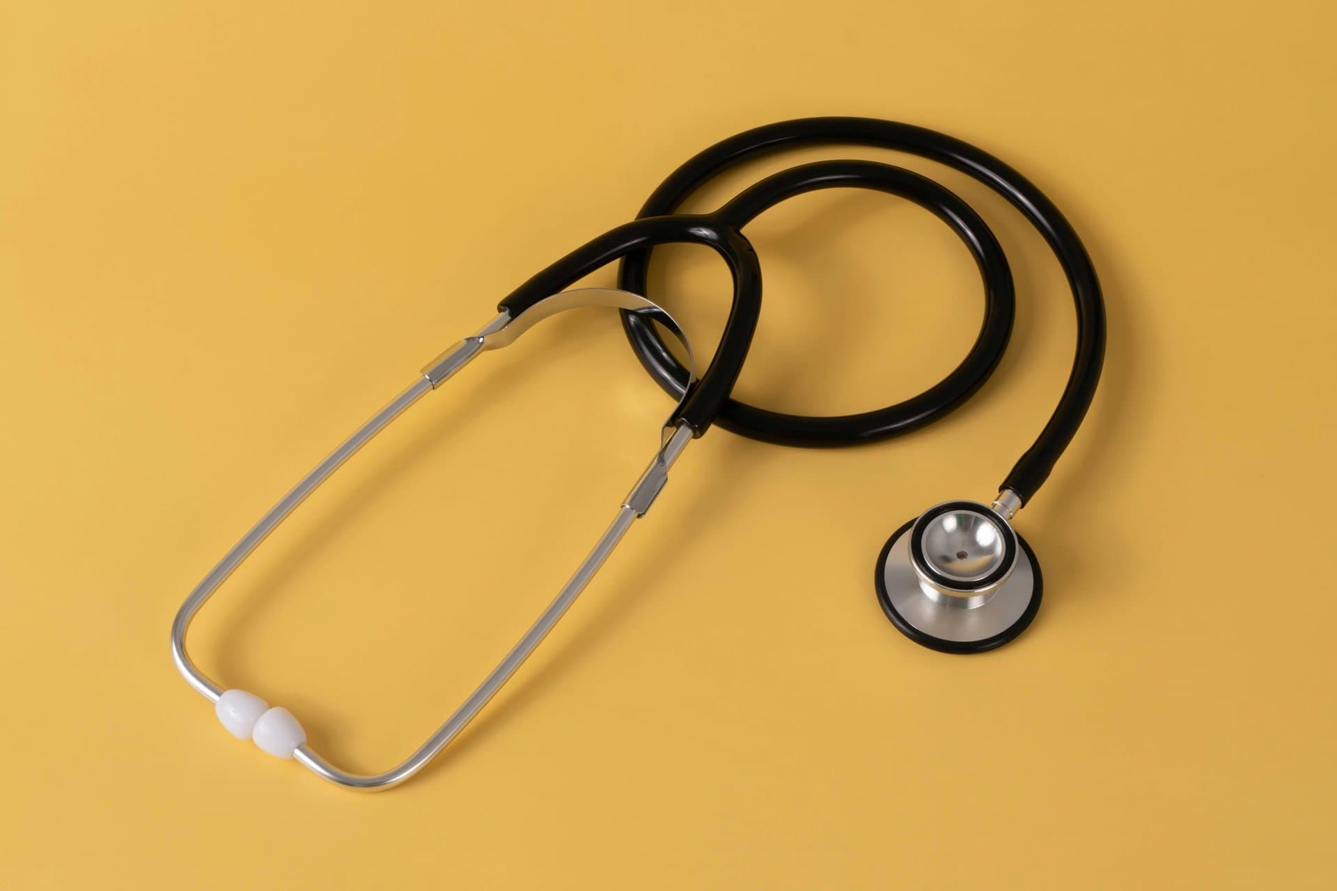 a stethoscope on a yellow background