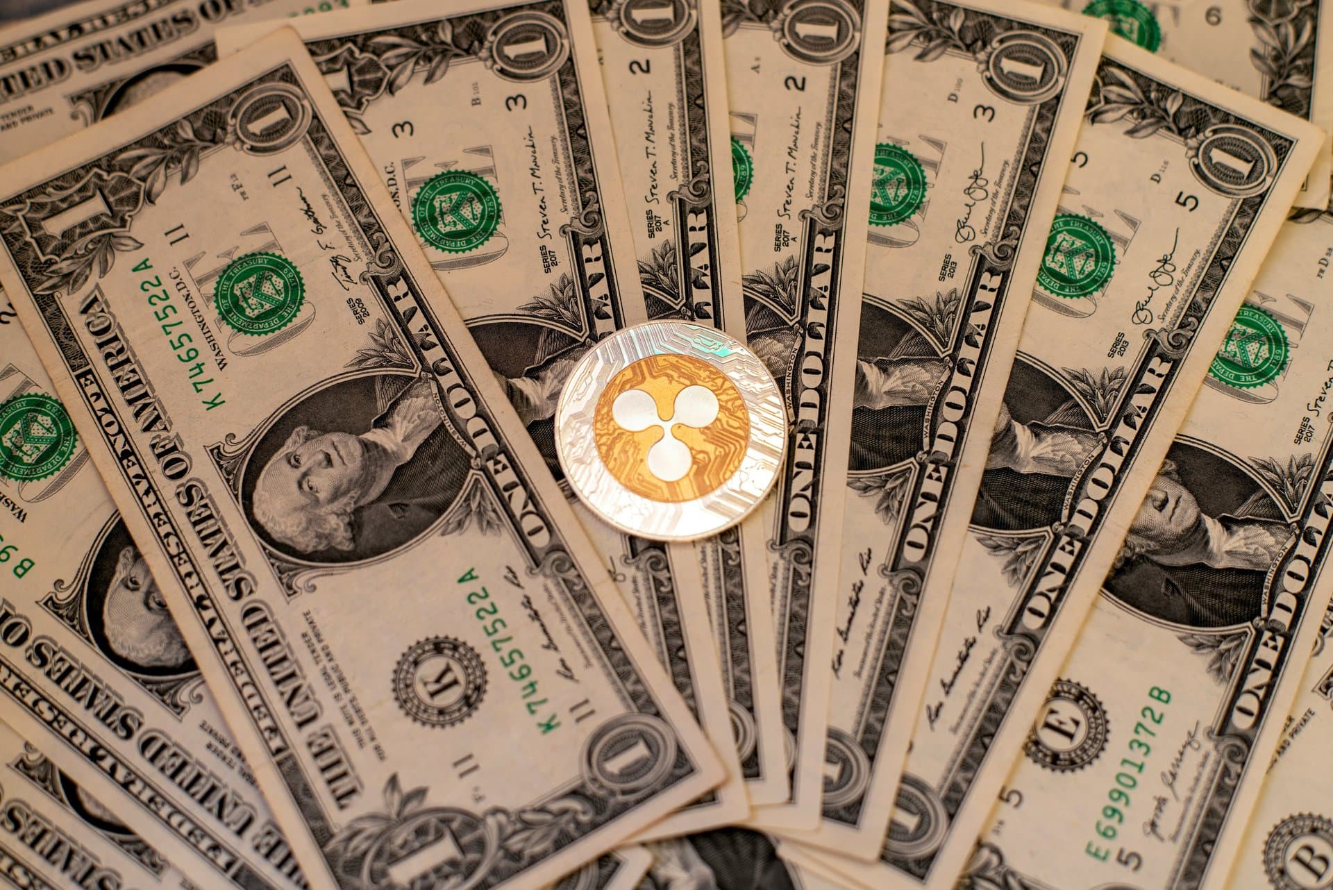 an xrp logo on dollar bills