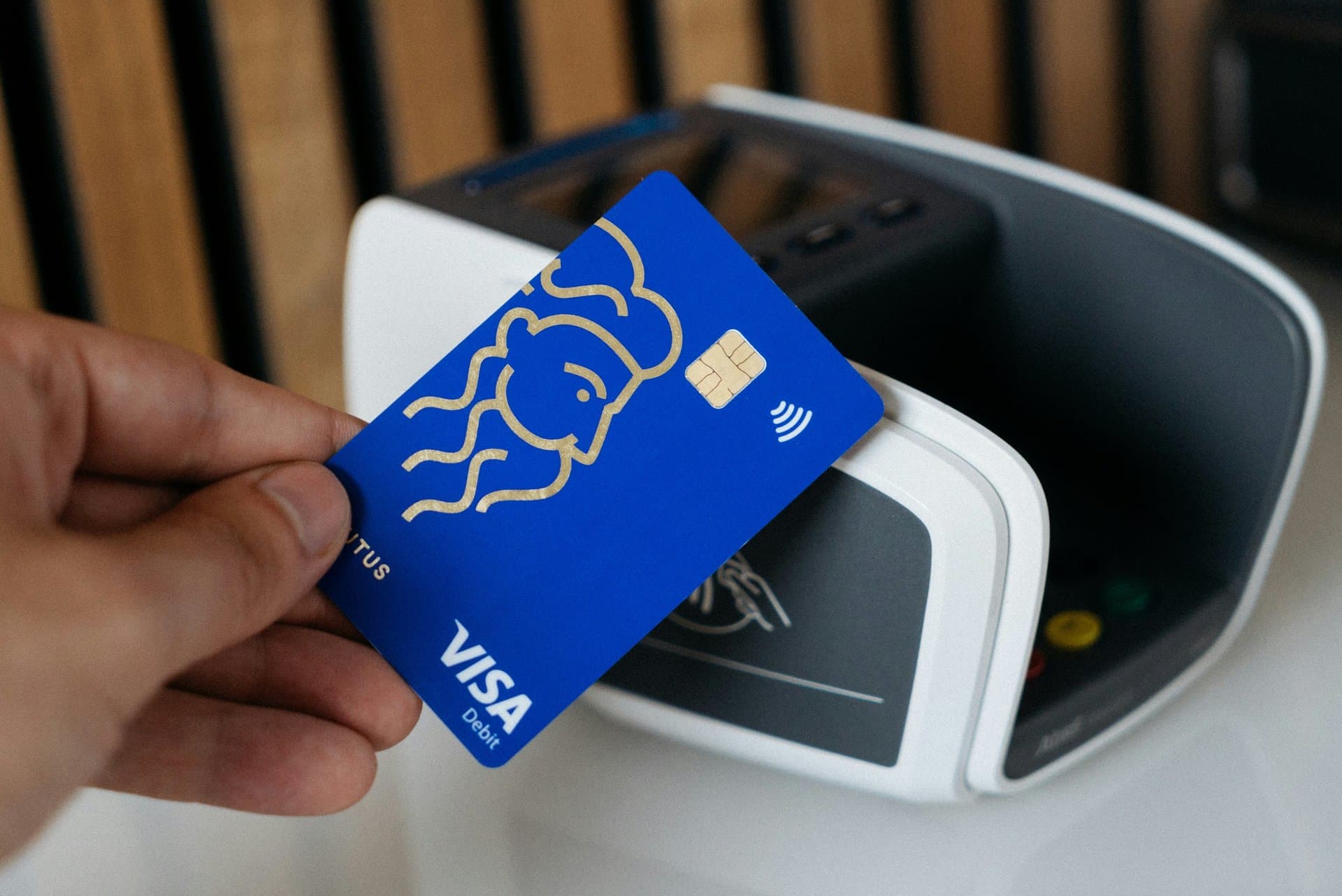 a visa card being tapped on card machine