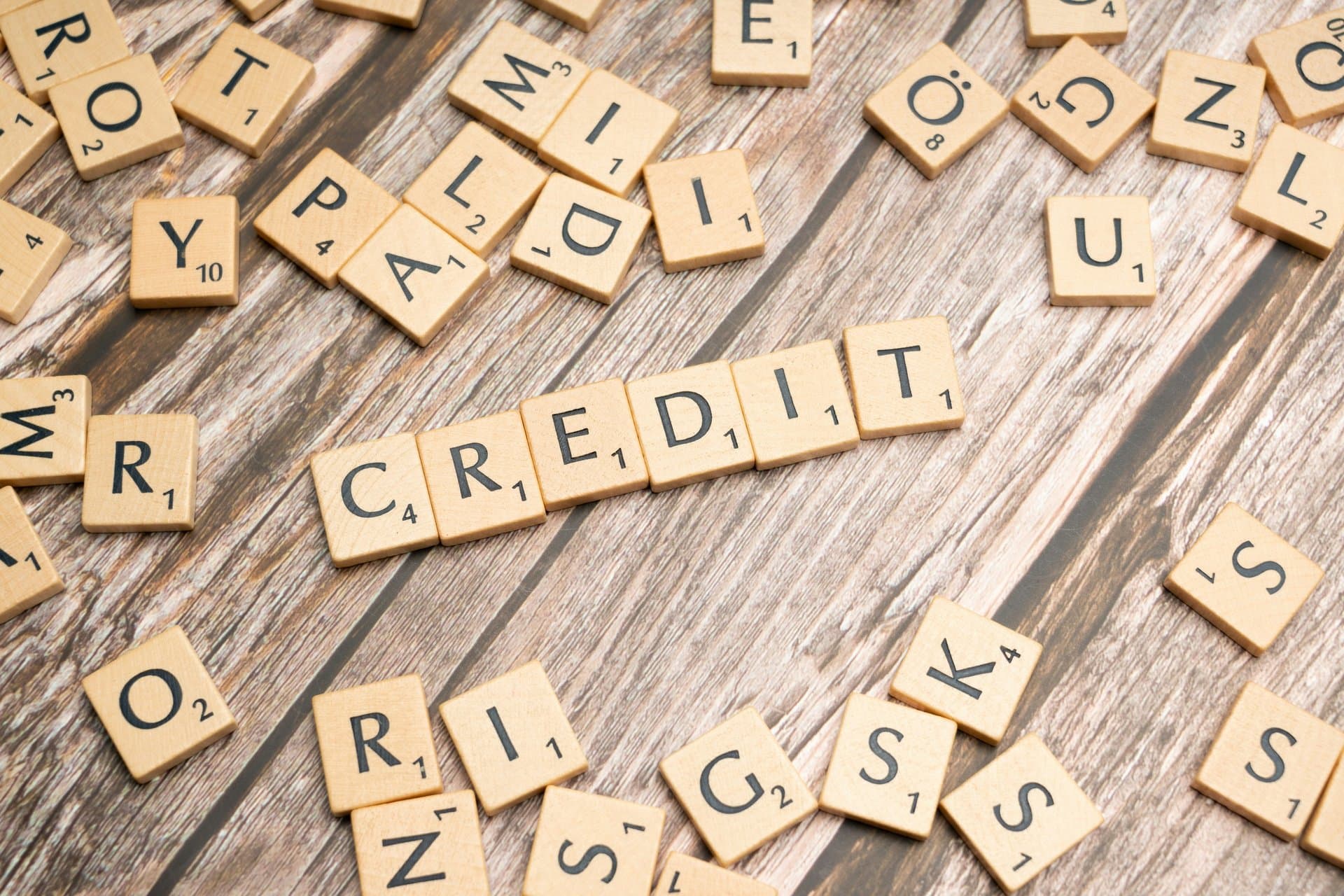 A scrabble tile that reads 'credit'