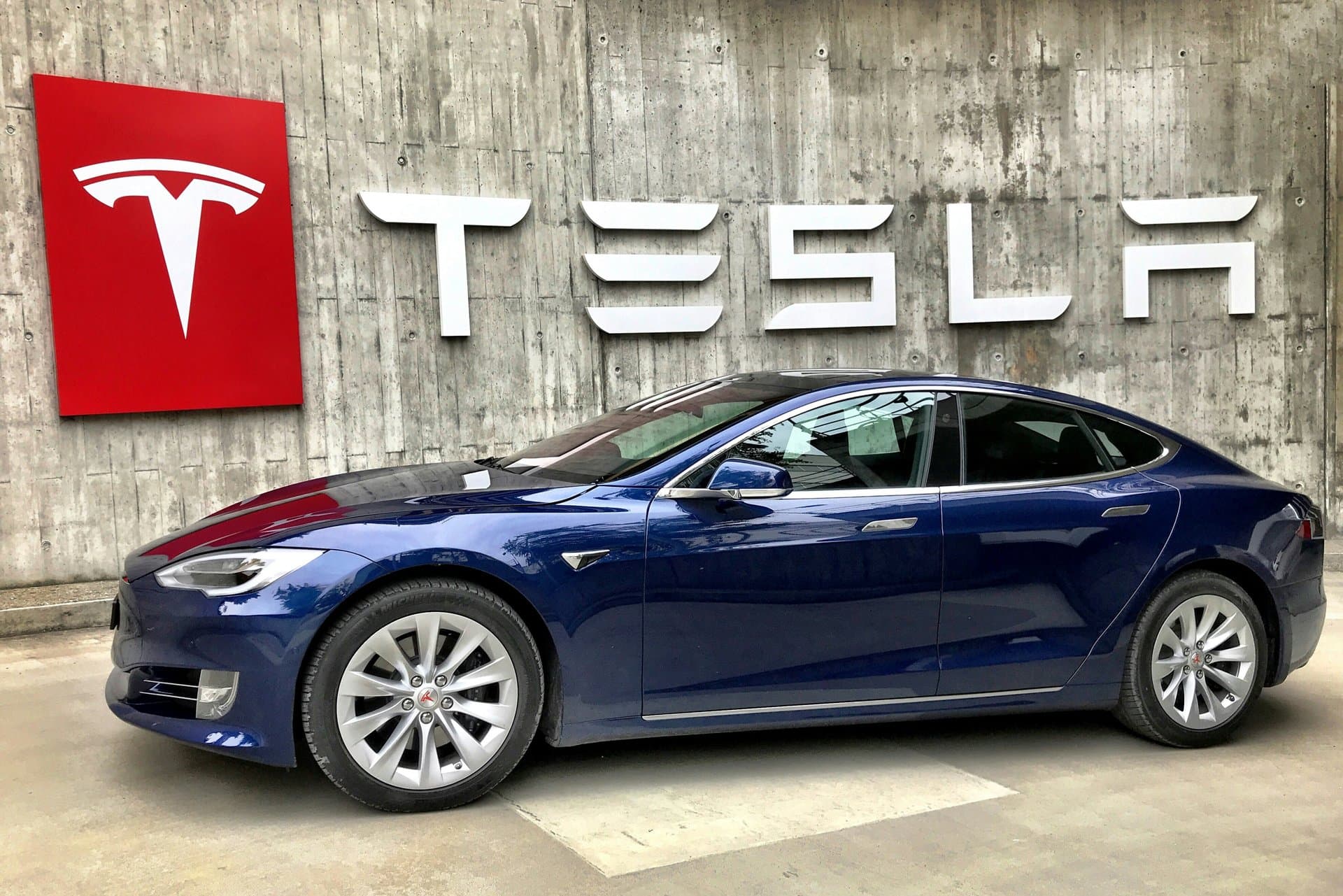 tesla logo with car