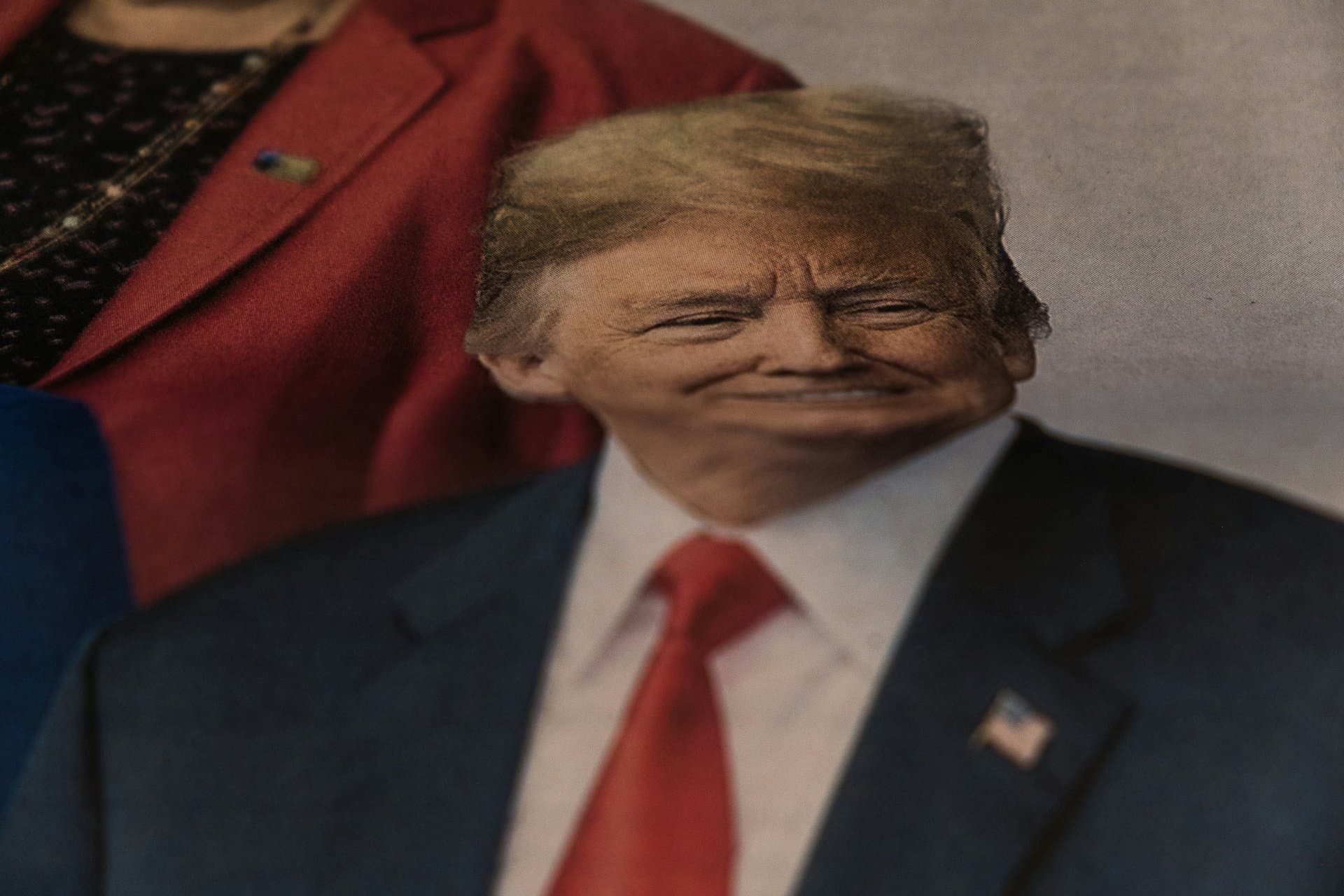 a distorted face of trump on a newspaper