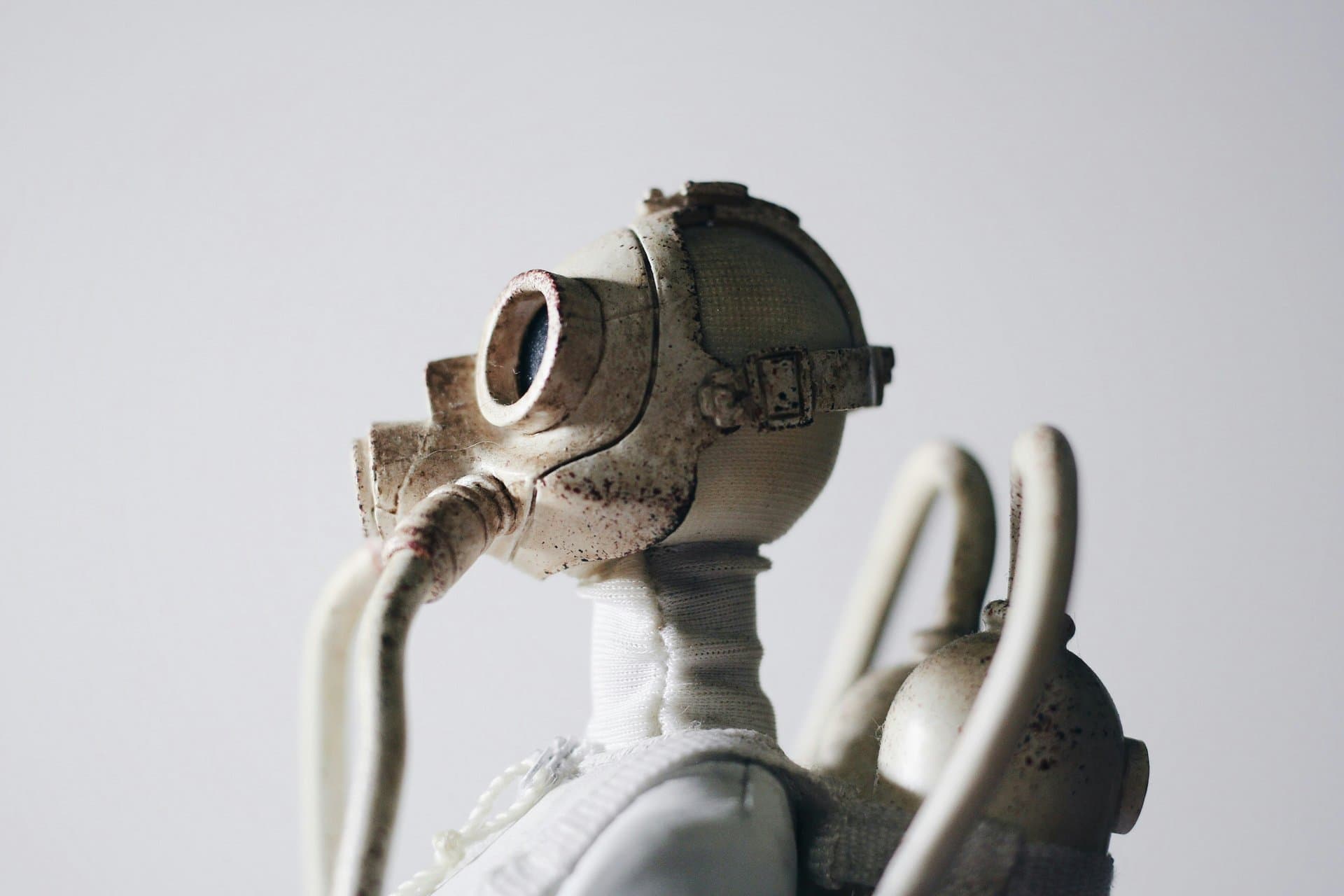 a white mannequin wearing mask