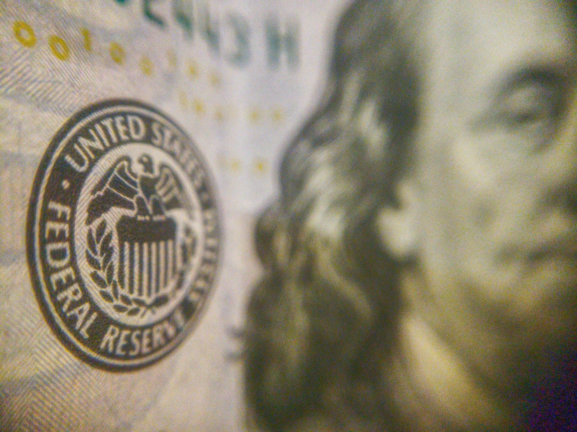a dollar bill showing text Federal Reserve