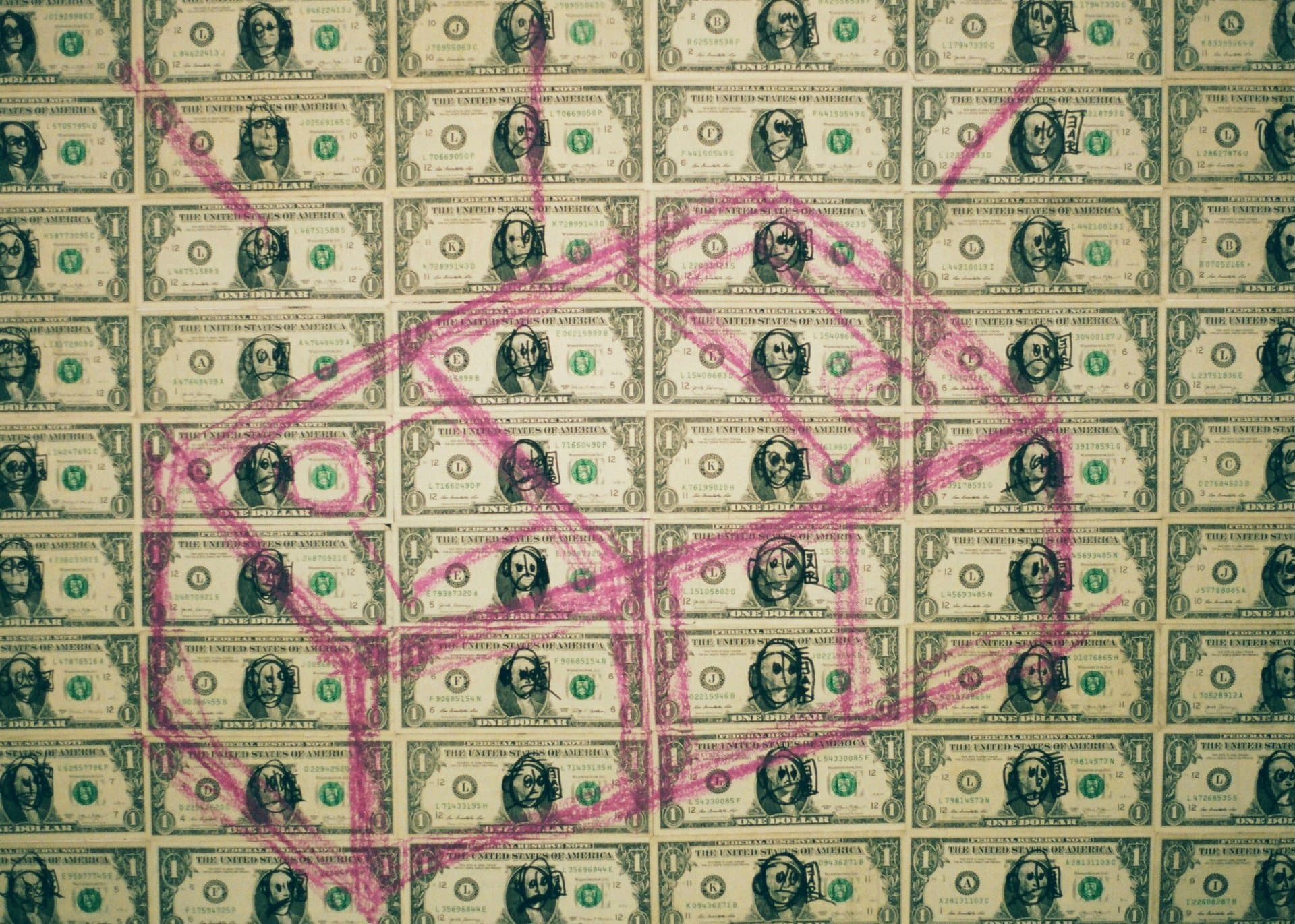 a bed of dollars doodled upon