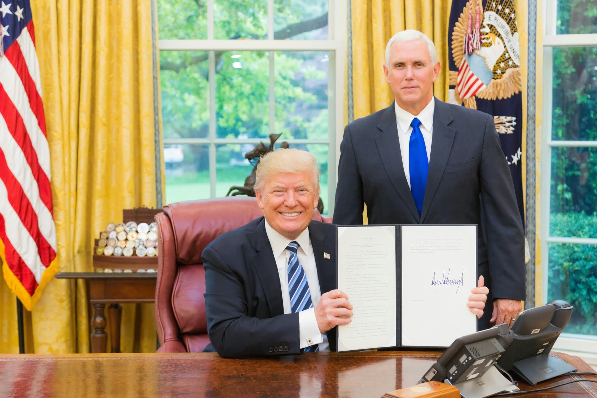trump signing executive orders in his office