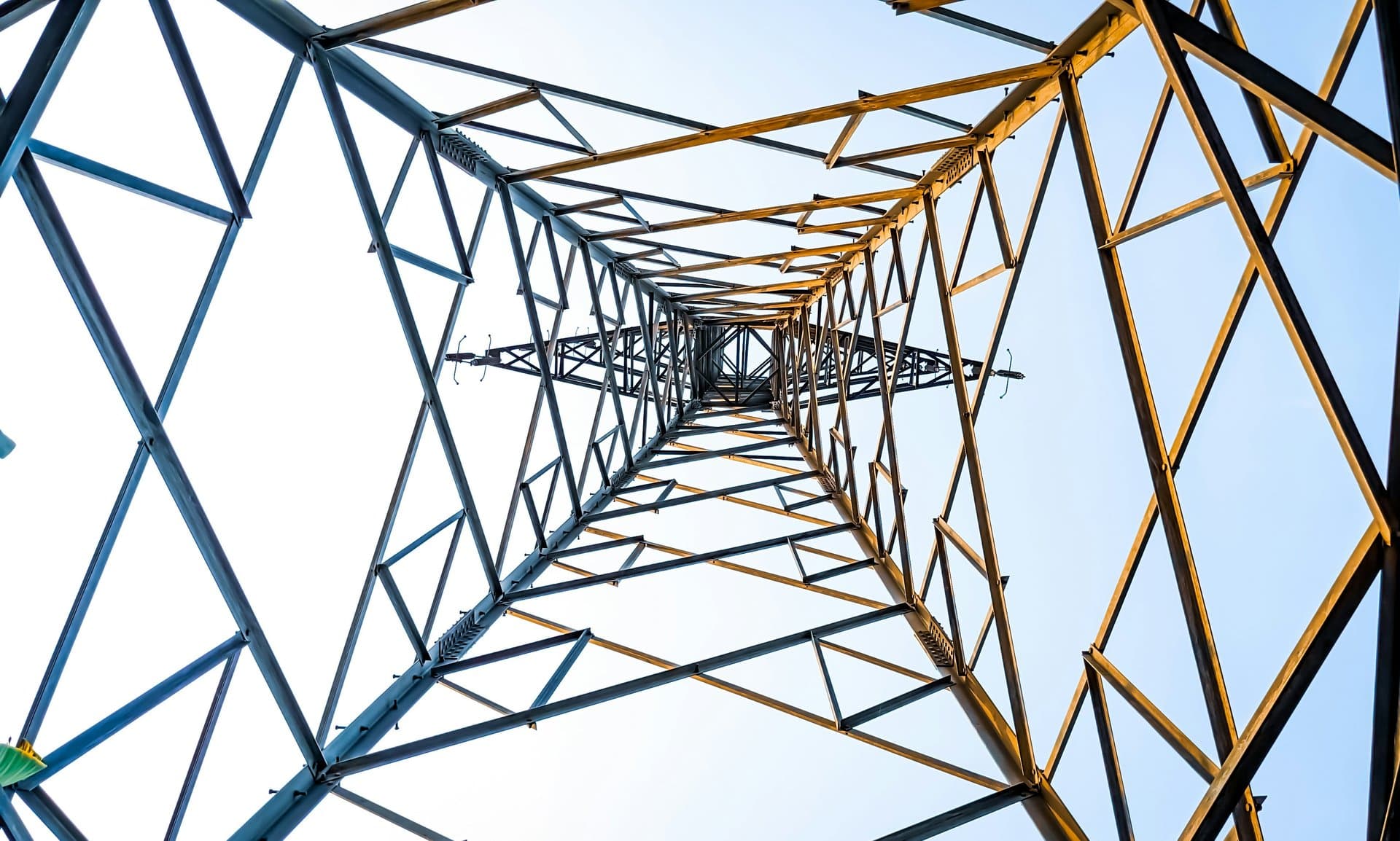 Low angle shot of an energy grid tower