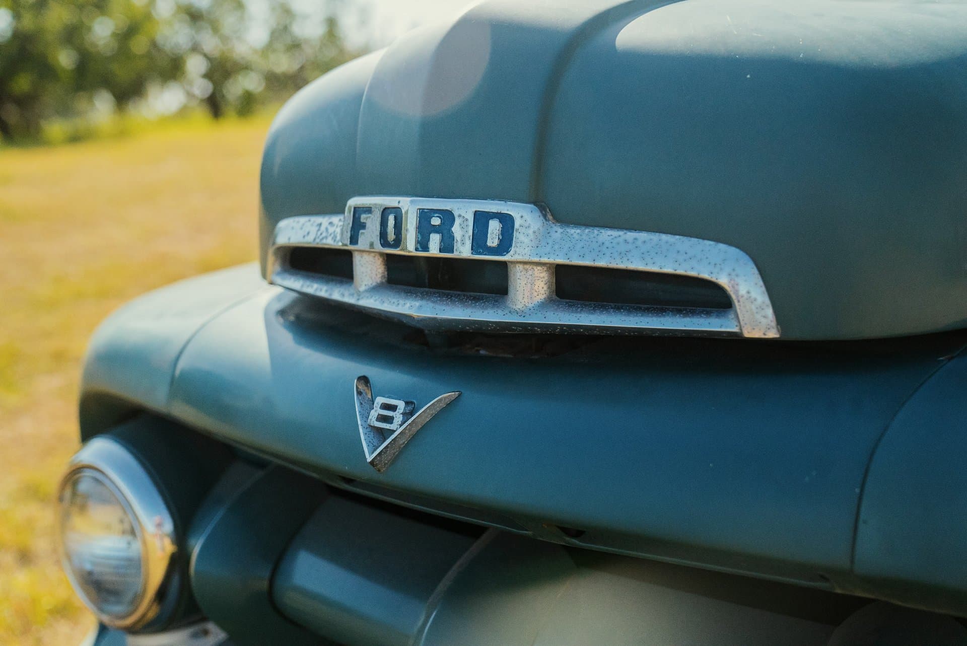 A vintage car hood with Ford Logo