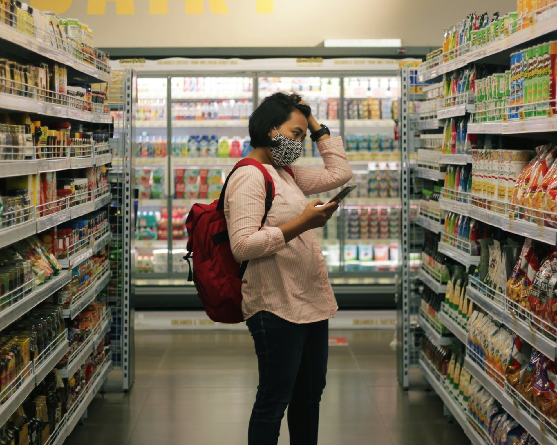 a woman confused in supermarket