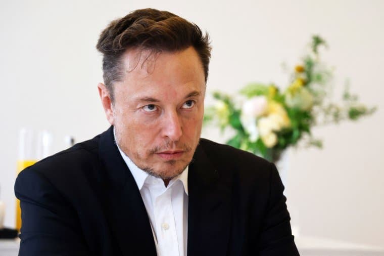 a man sitting with a serious face