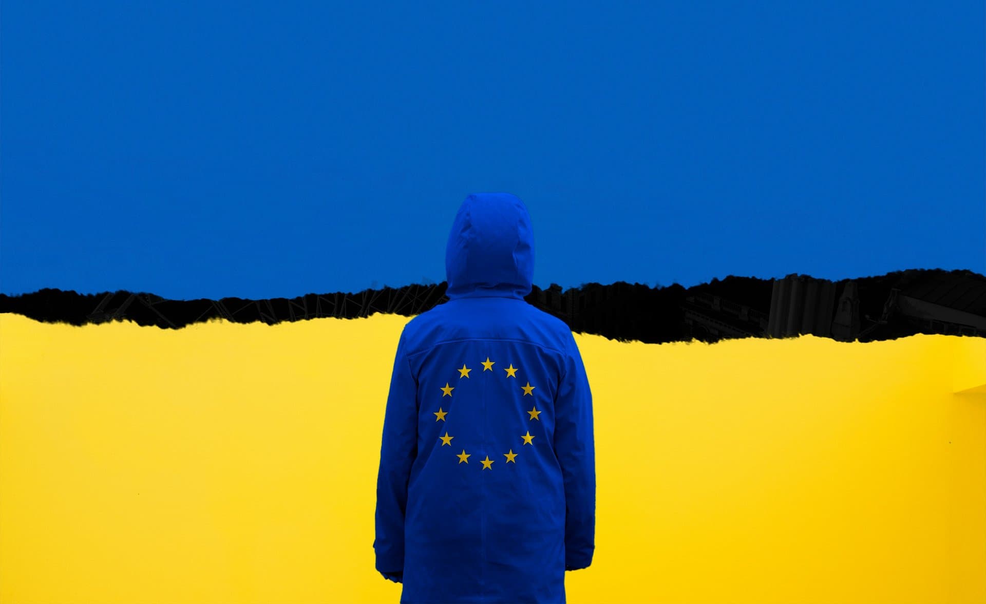 a person weraing EU flag standing in front of Ukrainian flag