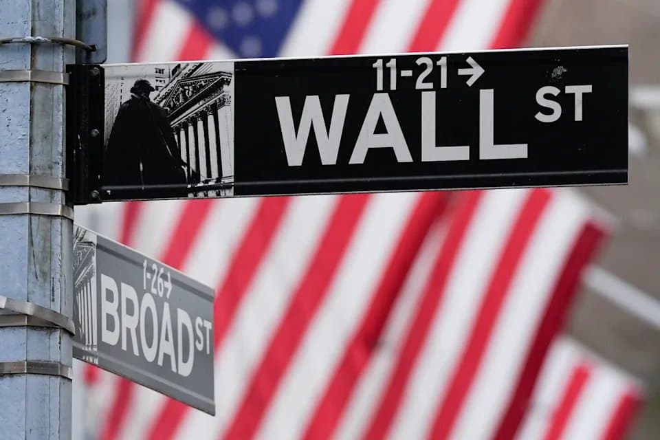 Street signs for Wall Street and Broad Street in New York City
