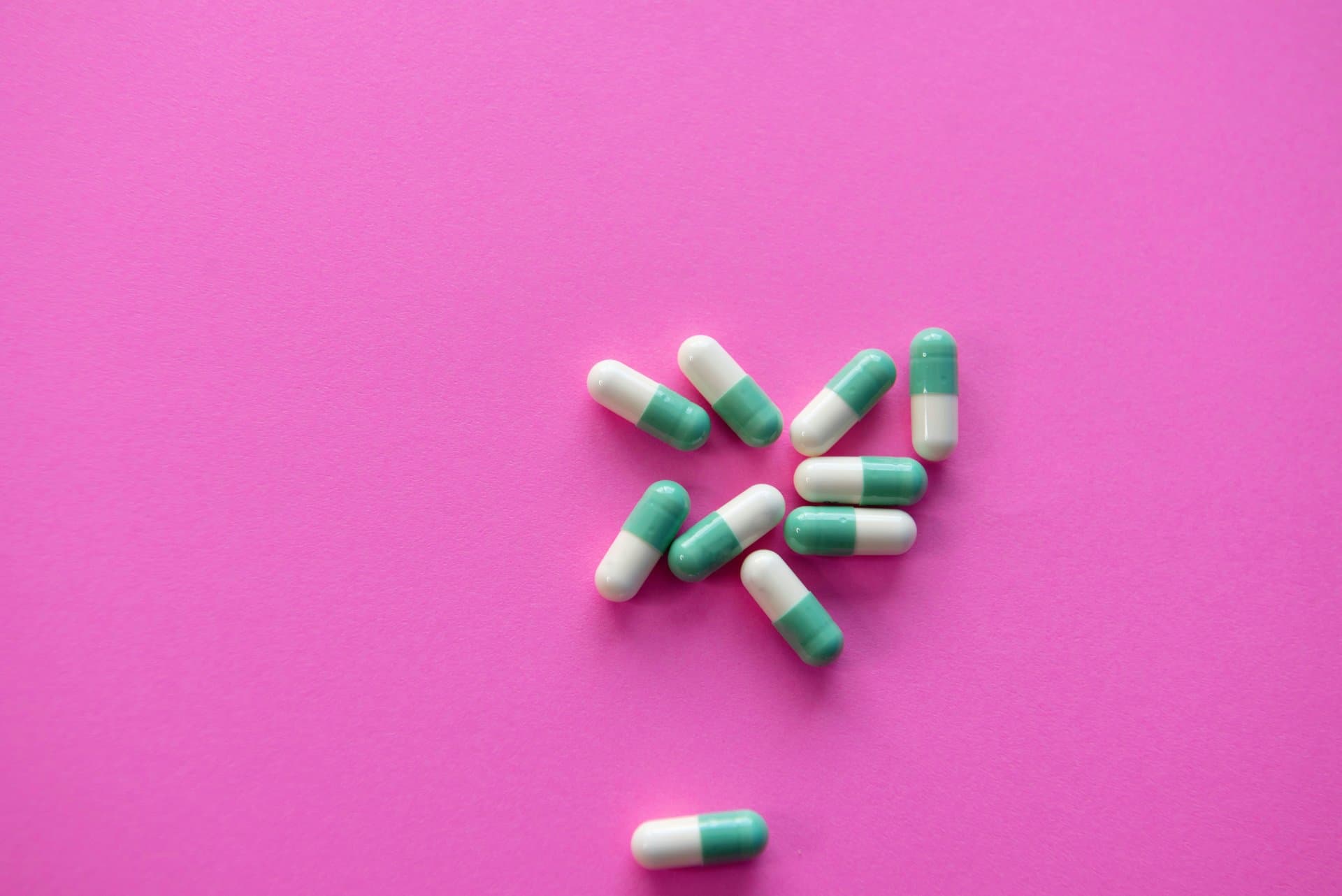 pills on a pink background