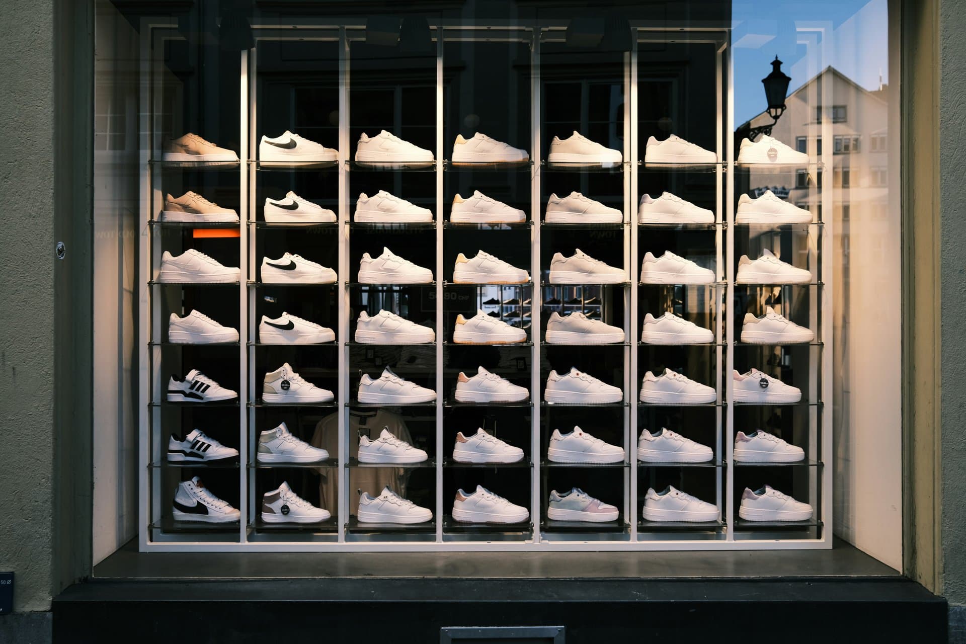 a range of shoes on display at the store window