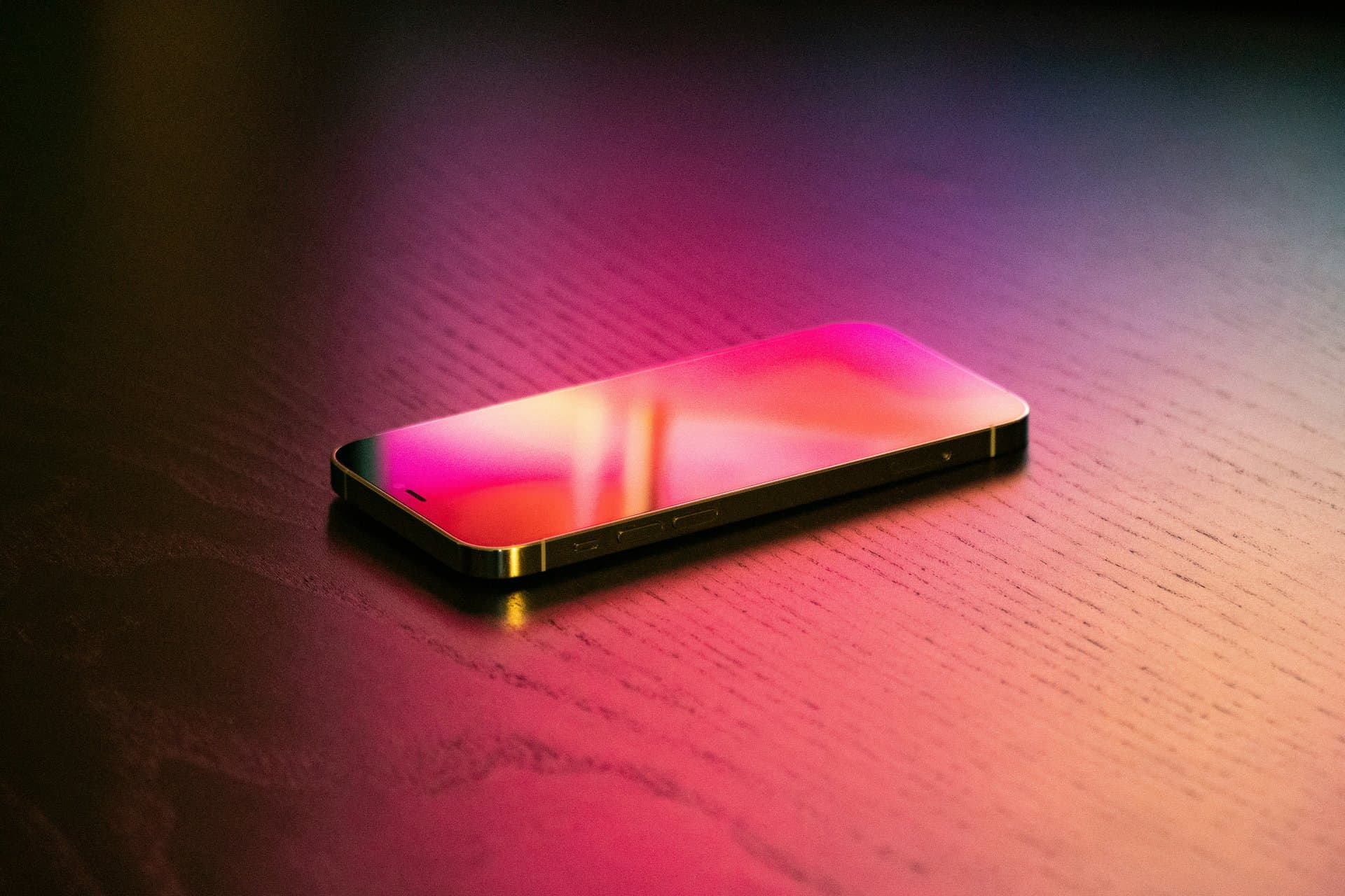 an iphone under purple night light