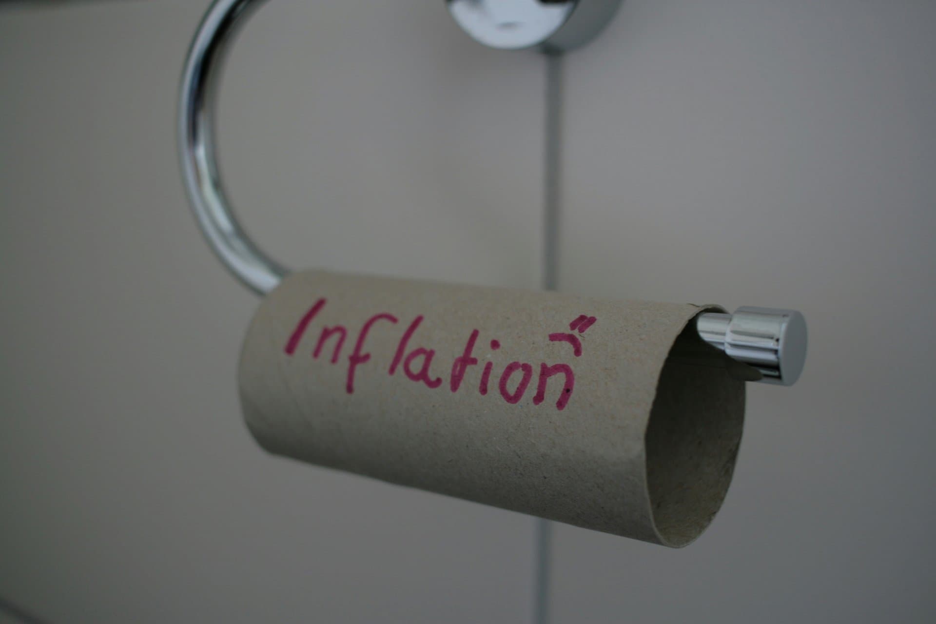 an empty toilet paper roll with Inflation written on it