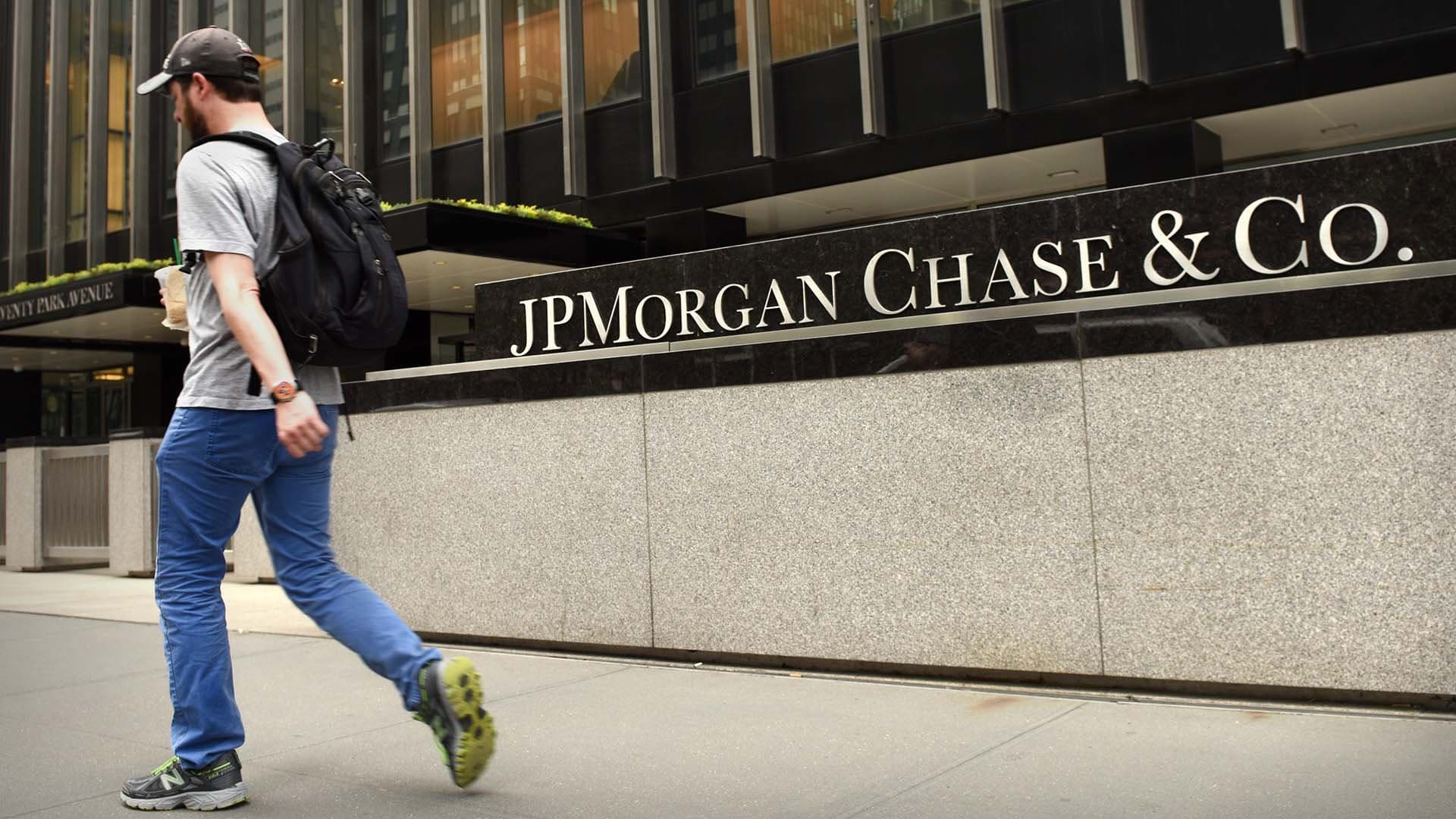 a man passing by a building entrance