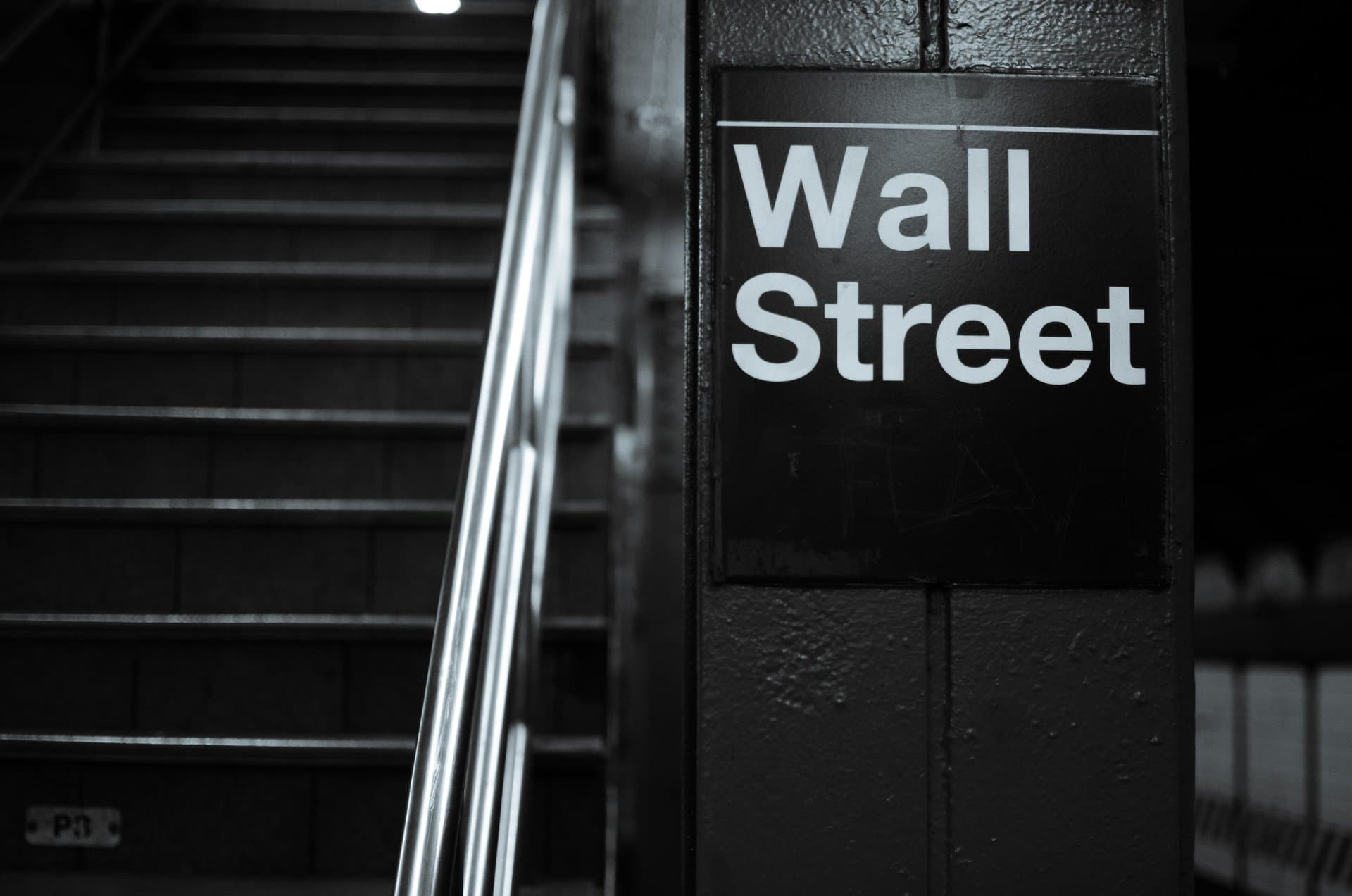 a pillar with Wall Street signage