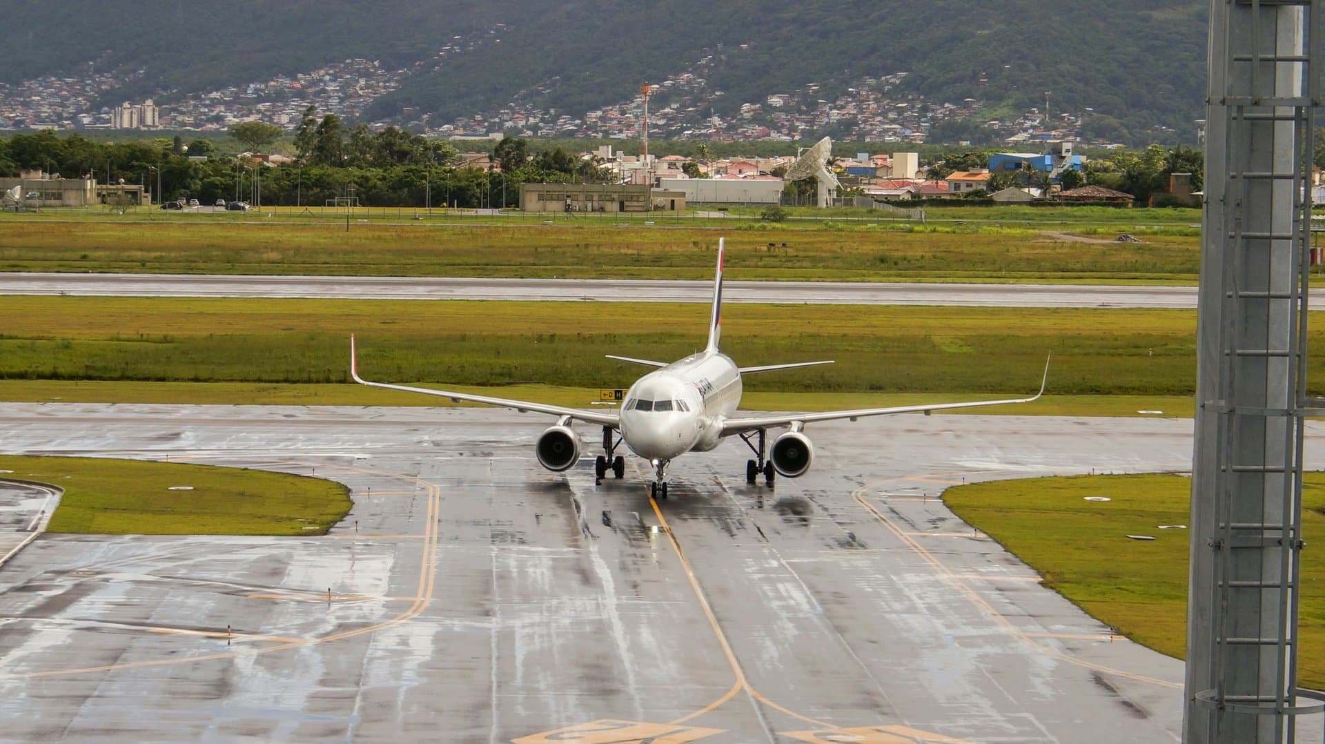 an airplane parking at the gate after taxi