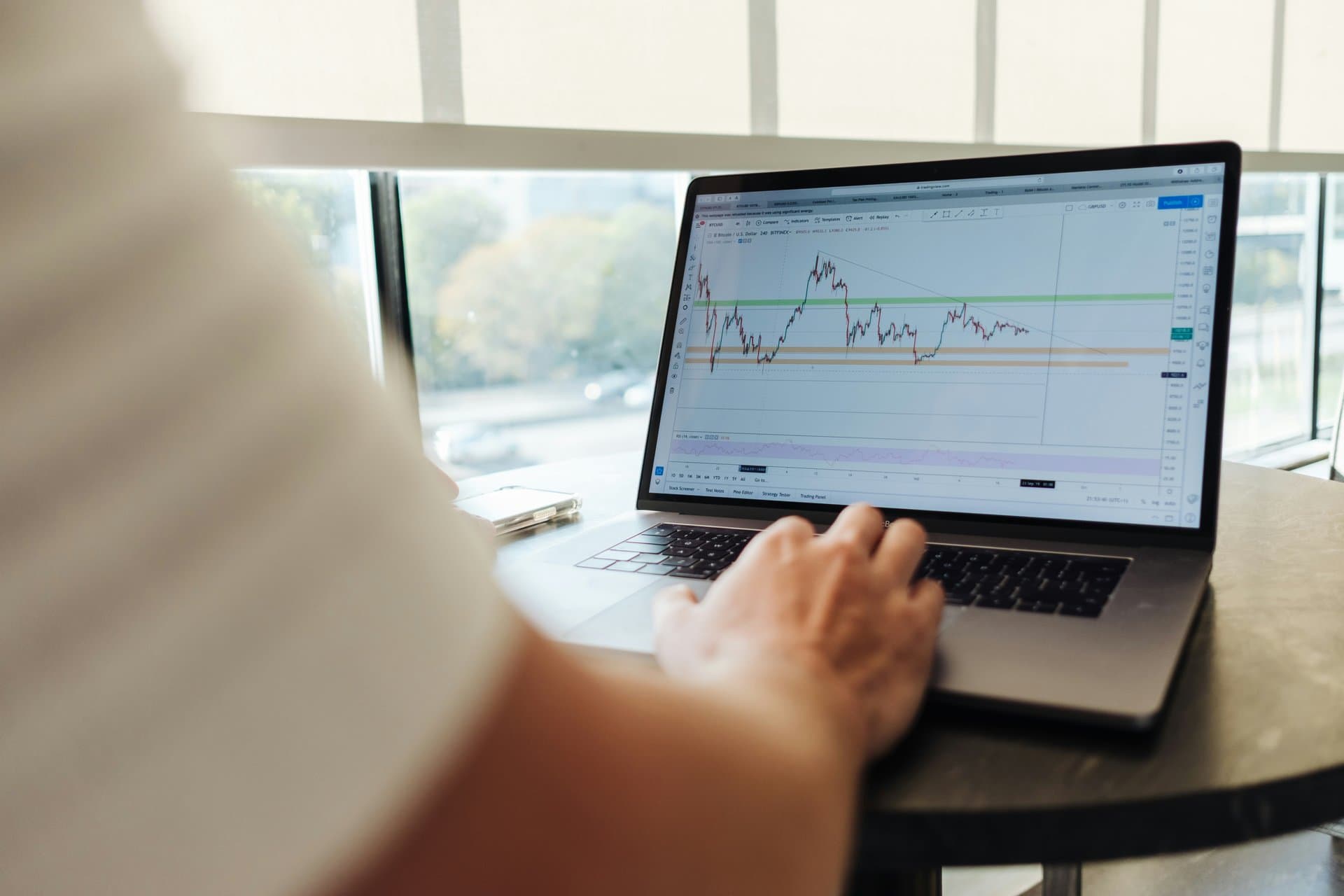 a computer with stock charts on screen