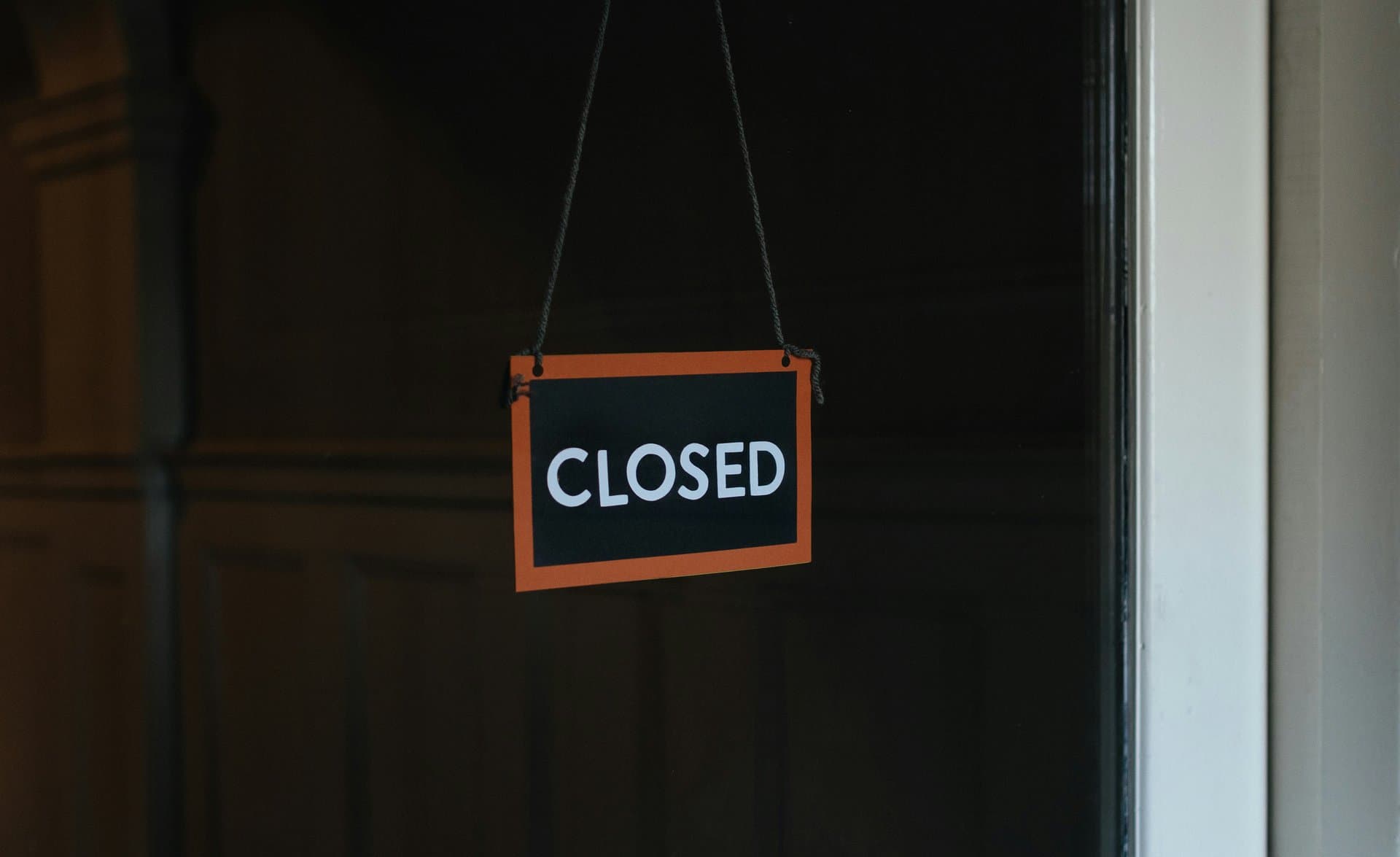 a closed sign at the door