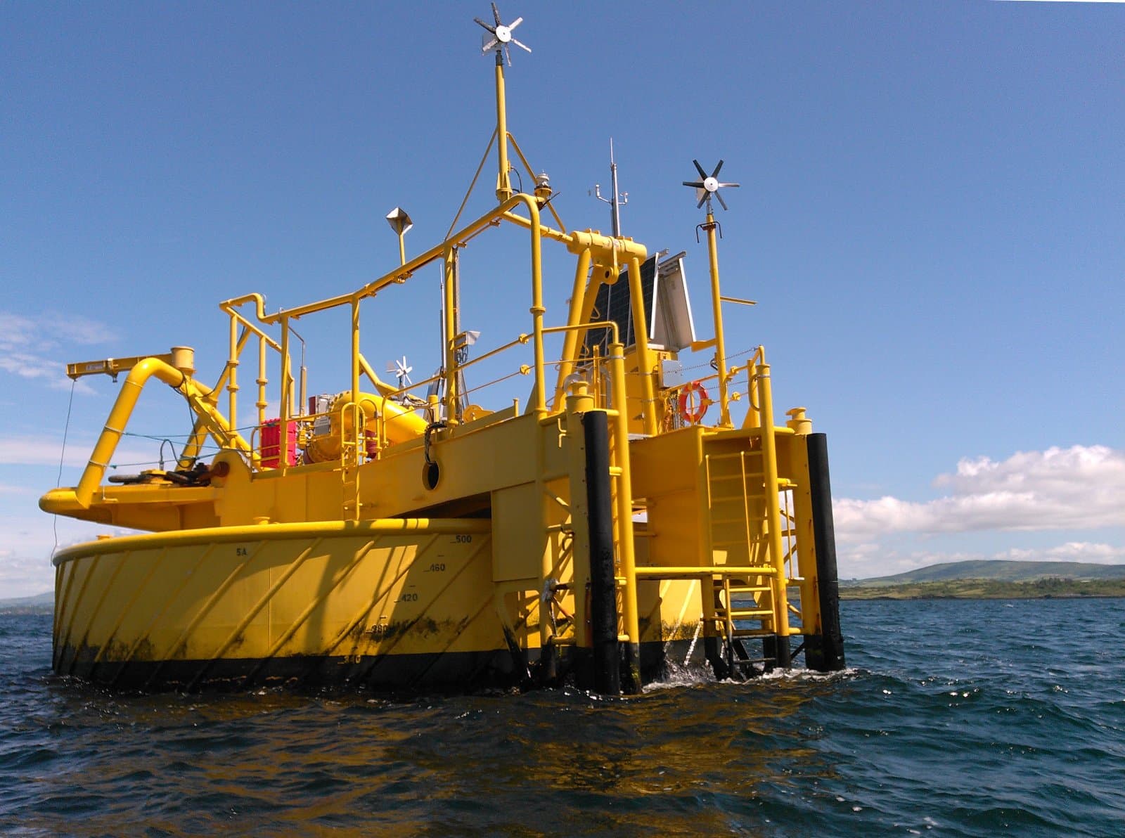 a yellow vessel in the water