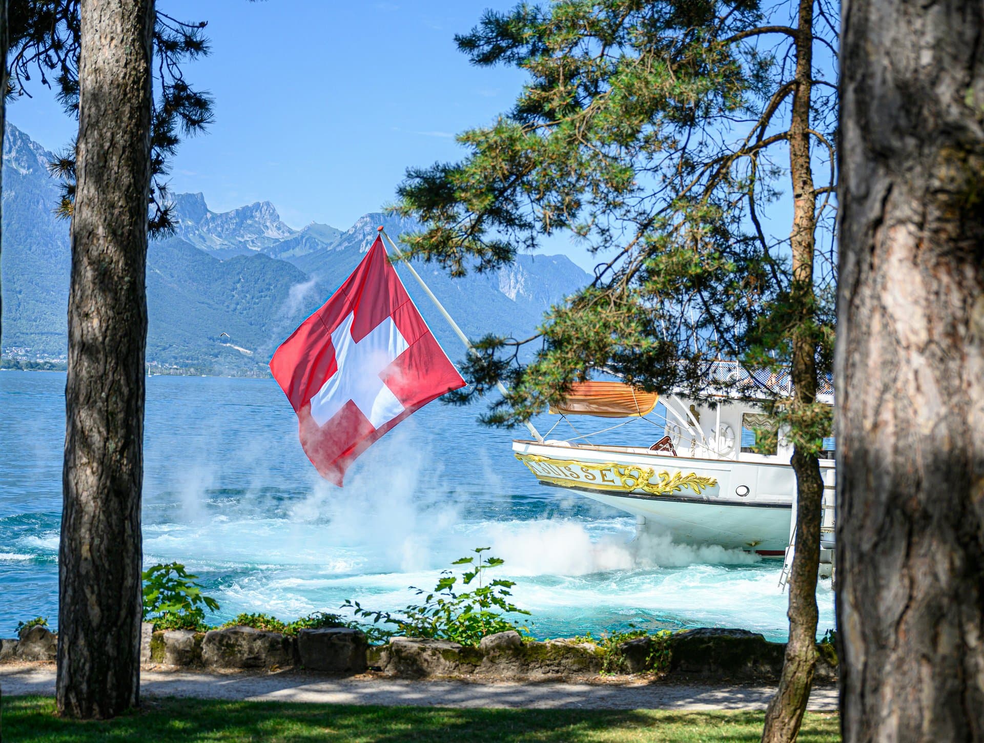 a swiss flag near a boat