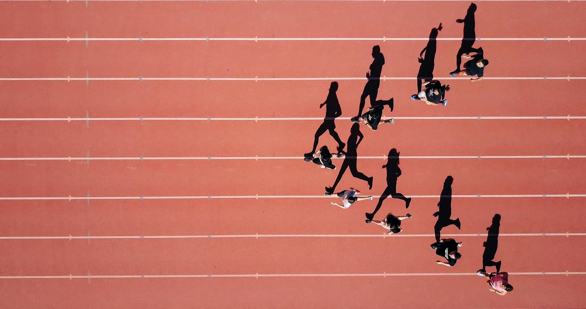 athletes running on track