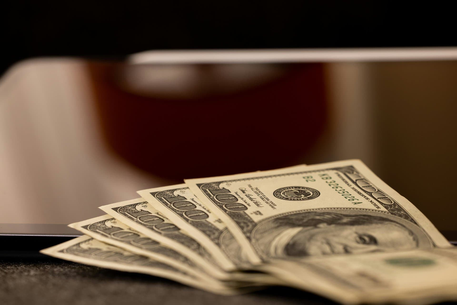 pile of dollars on a table