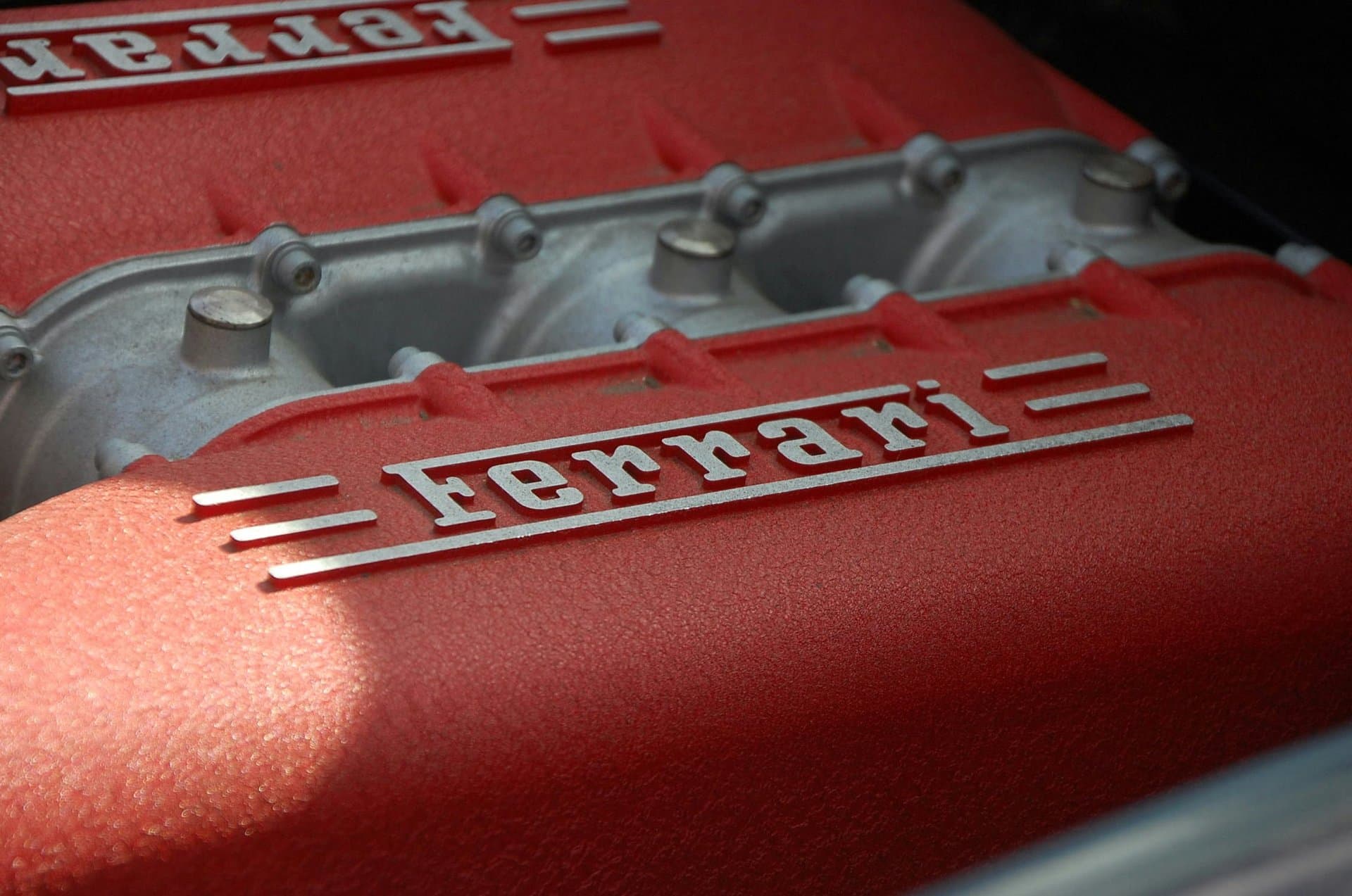 A Ferrari car engine with logo