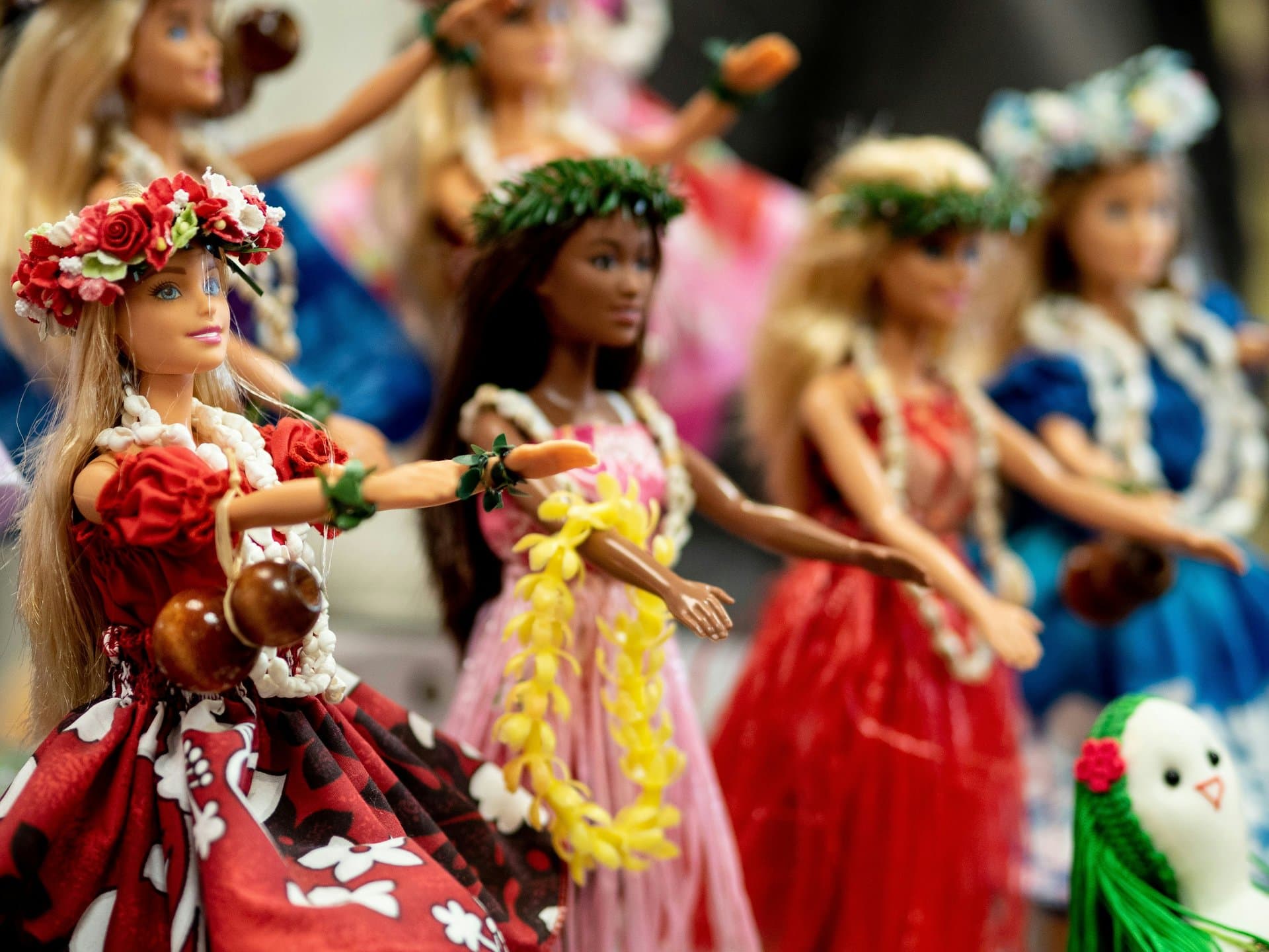 A set of Barbie Dolls dressed in colorful clothes