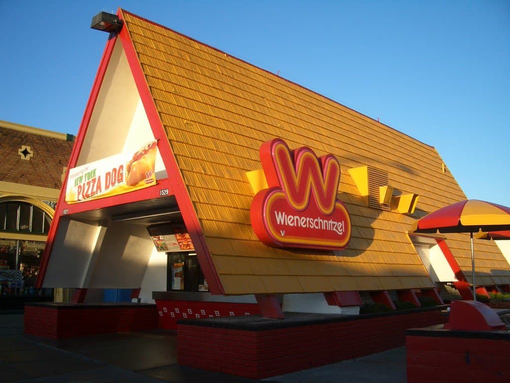 a yellow and red fast food restuarant building