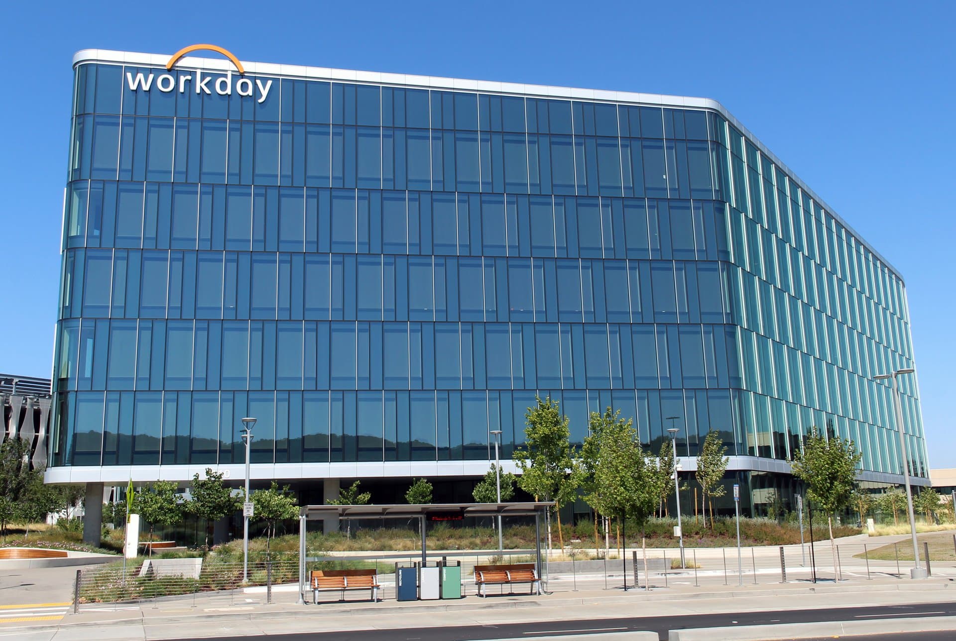 a big glass building on a sunny day